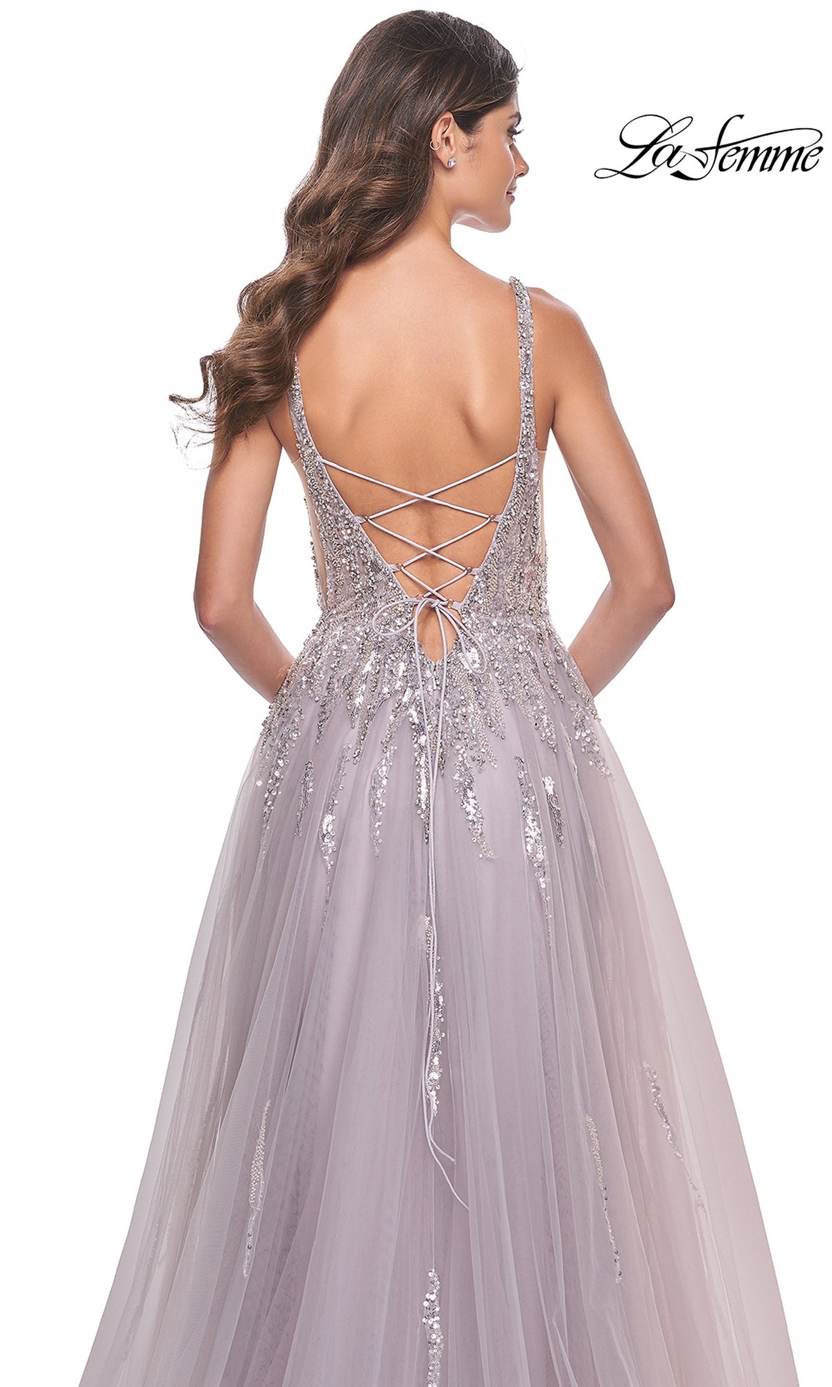 A woman in the Sequined Long Mauve Prom Dress: La Femme 31995, featuring an A-line silhouette and lace-up open back, stands against a white background.